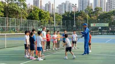 Junior group practicing net play at Victoria Park