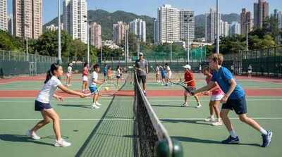 Junior group practicing doubles at Victoria Park