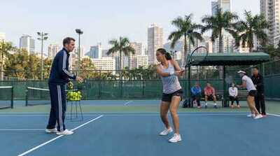 Adult practicing with coach at Victoria Park