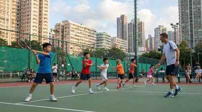 Junior group practicing backhands at Victoria Park